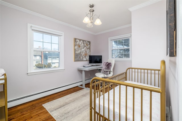 bedroom featuring a notable chandelier, crown molding, baseboard heating, and wood finished floors