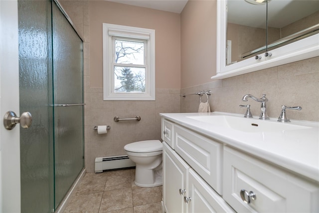 full bath with toilet, baseboard heating, a shower stall, vanity, and tile patterned flooring