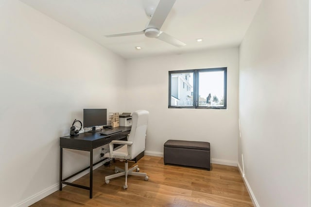 office space with ceiling fan, baseboards, and wood finished floors