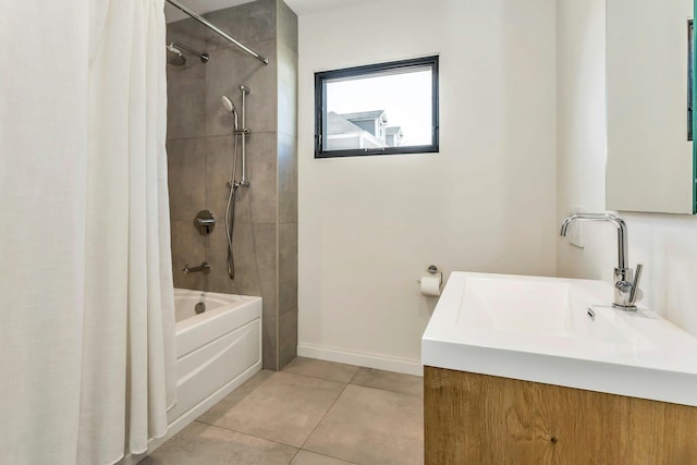 bathroom featuring baseboards, shower / bath combo with shower curtain, vanity, and tile patterned floors