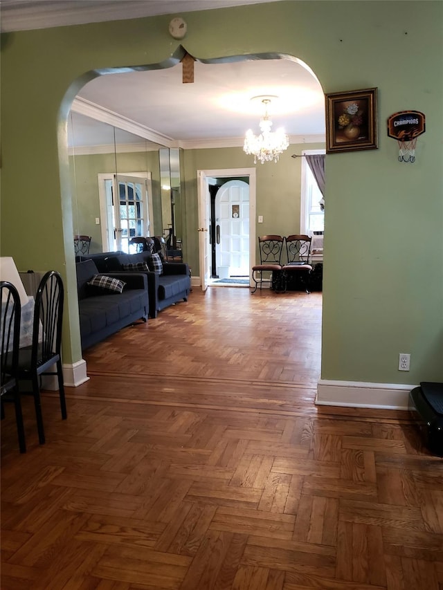 corridor with a healthy amount of sunlight, arched walkways, a notable chandelier, and ornamental molding