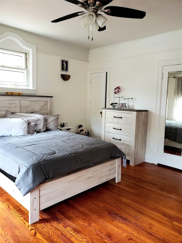 bedroom with ceiling fan and wood finished floors