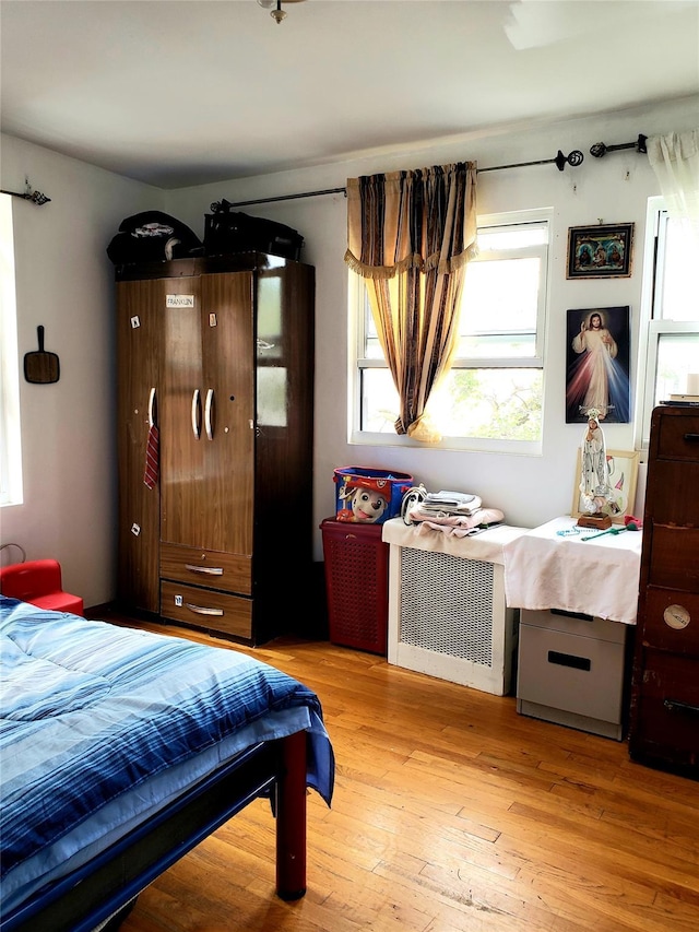 bedroom featuring light wood-type flooring