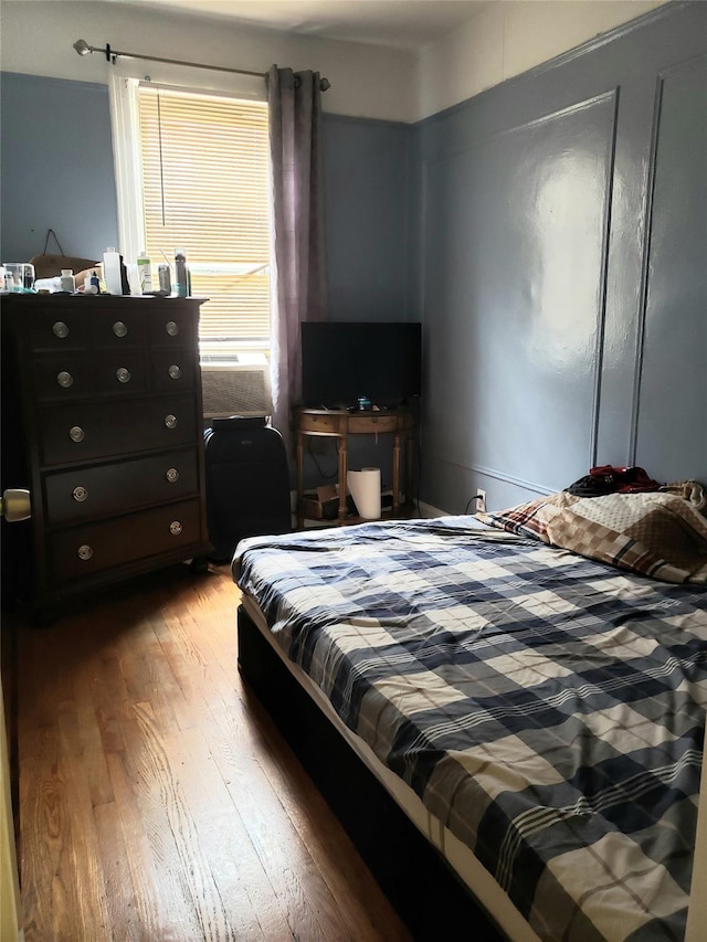 bedroom with wood finished floors