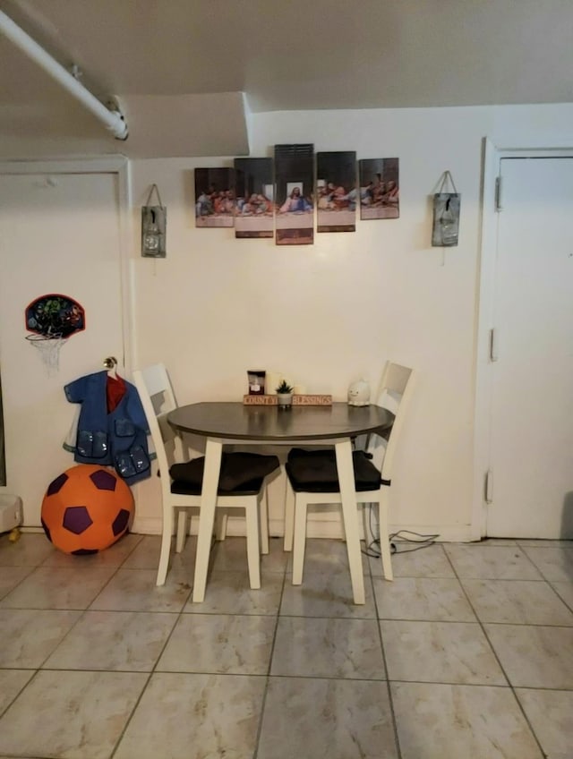 dining area with light tile patterned floors