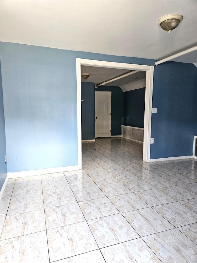 30-32 84th St, East Elmhurst, NY 11370 - spare room featuring baseboards