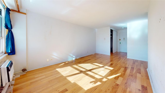 164-20 Highland Ave Unit 8W, Jamaica, NY 11432 - spare room featuring wood finished floors