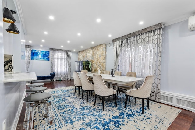 dining space with a wall unit AC, dark wood finished floors, recessed lighting, visible vents, and ornamental molding