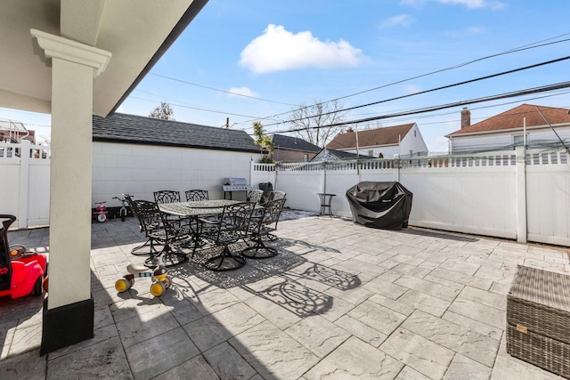 view of patio / terrace with outdoor dining area and a fenced backyard