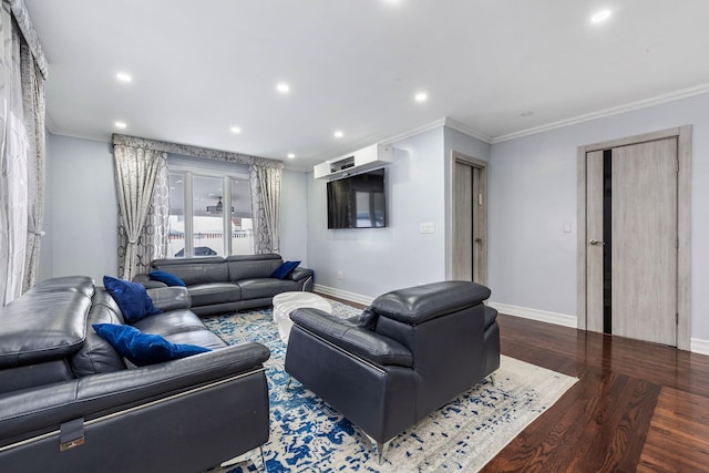 living area with ornamental molding, wood finished floors, and baseboards