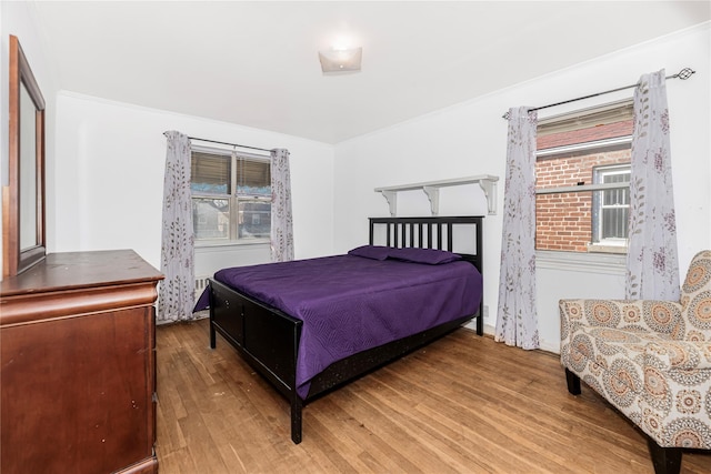 bedroom with wood finished floors