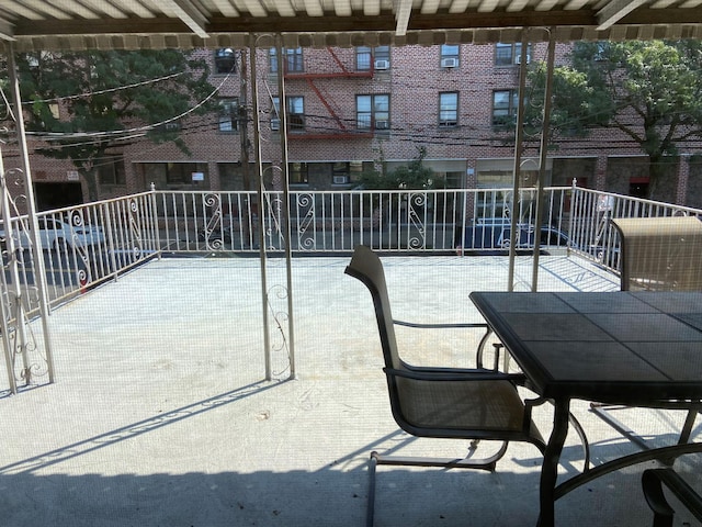 view of patio featuring fence