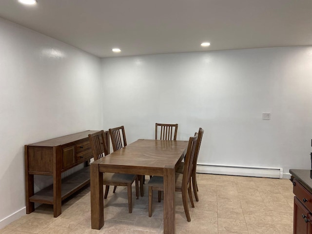 dining space featuring baseboards, a baseboard heating unit, and recessed lighting