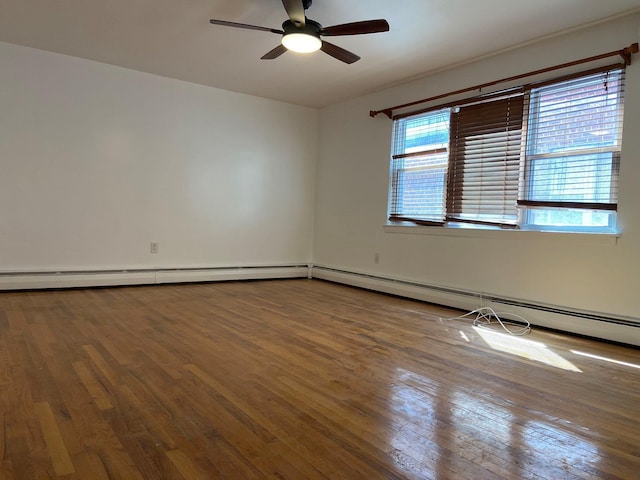 spare room with ceiling fan and hardwood / wood-style floors