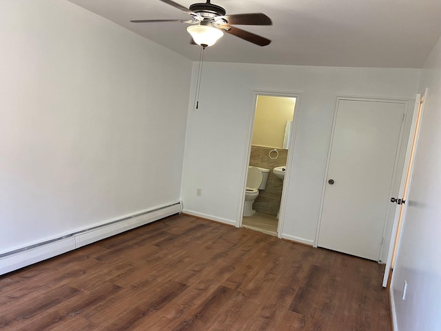 unfurnished bedroom featuring baseboards, a baseboard radiator, ceiling fan, dark wood-style flooring, and ensuite bathroom