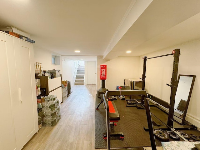 workout area featuring light wood-type flooring