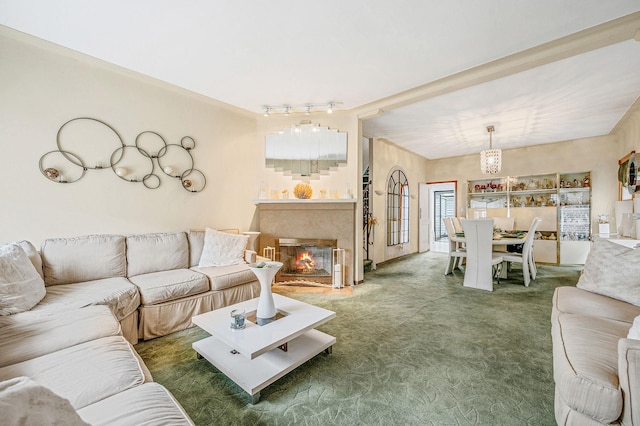 living room with a glass covered fireplace and carpet flooring