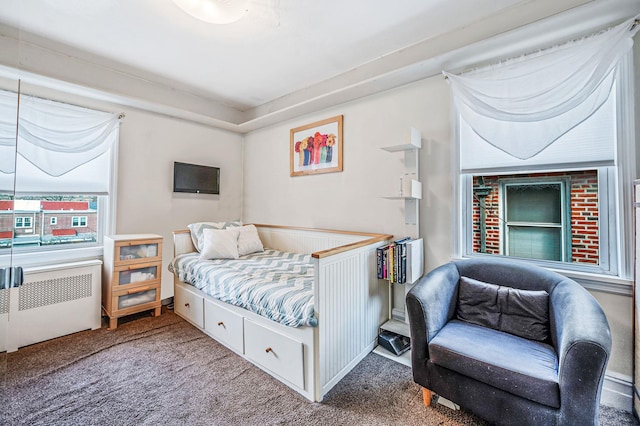 carpeted bedroom featuring radiator heating unit