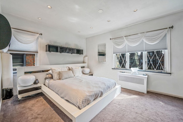 carpeted bedroom featuring recessed lighting, baseboards, and radiator