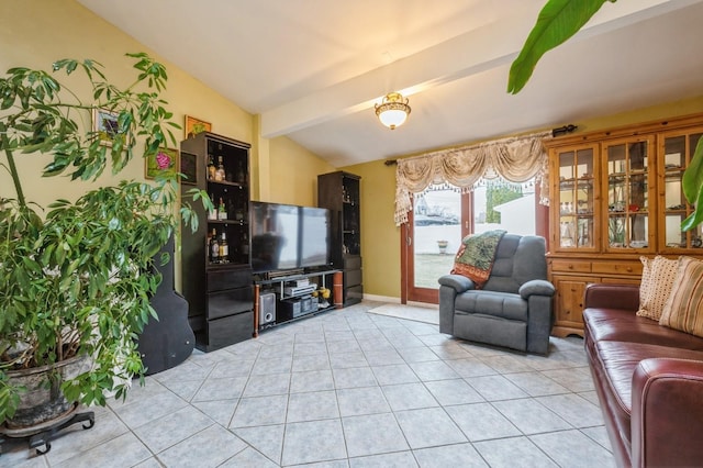 living area with lofted ceiling with beams, light tile patterned floors, and baseboards