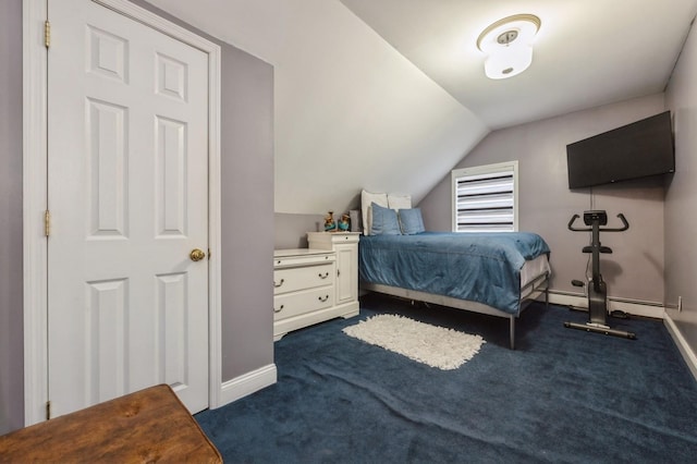 bedroom featuring vaulted ceiling, dark colored carpet, a baseboard radiator, and baseboards