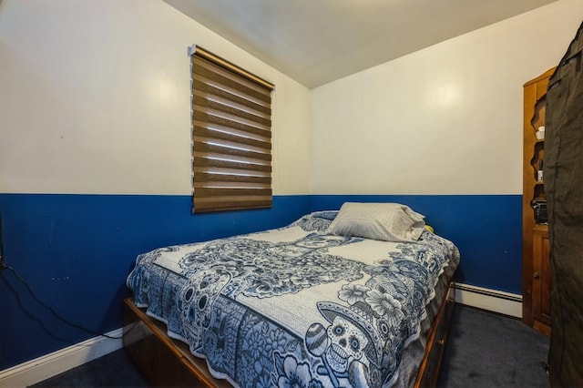 carpeted bedroom featuring baseboards and baseboard heating