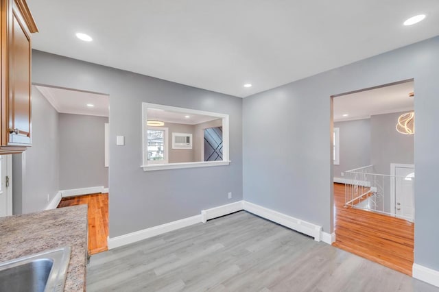 interior space with recessed lighting, baseboards, and light wood finished floors