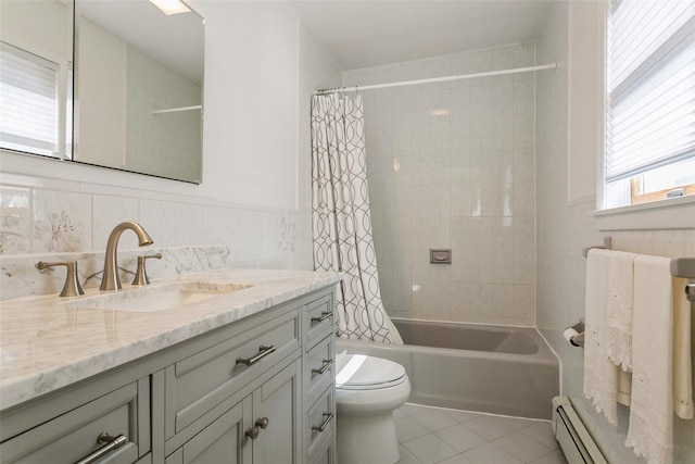 bathroom featuring a wainscoted wall, toilet, baseboard heating, vanity, and tile patterned floors