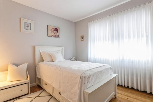 bedroom with light wood-type flooring