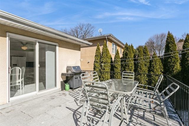 view of patio / terrace featuring outdoor dining space, a grill, and a balcony