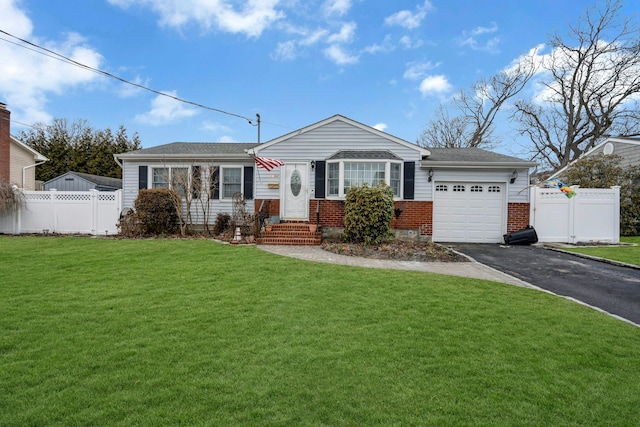 ranch-style home with an attached garage, fence, aphalt driveway, and brick siding