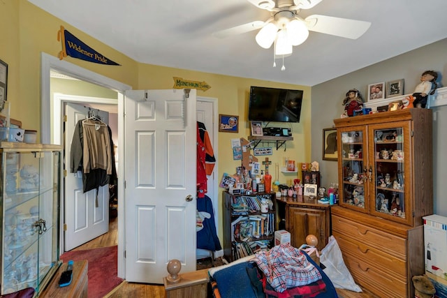 bedroom with ceiling fan and wood finished floors