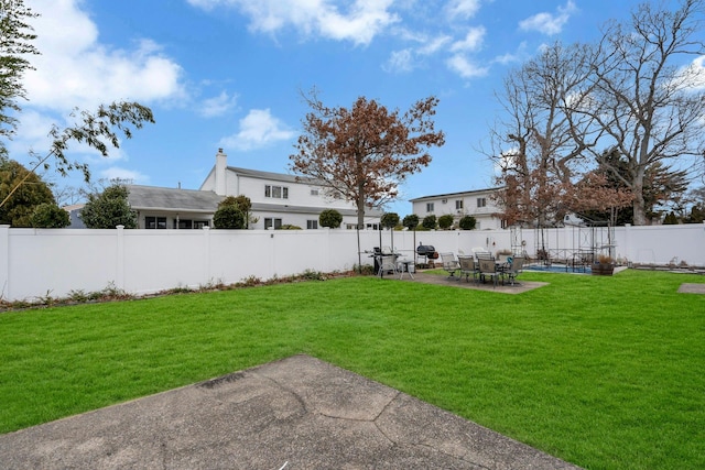 view of yard with a patio area and a fenced backyard