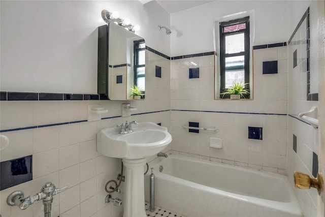 full bath featuring a bathtub and tile walls