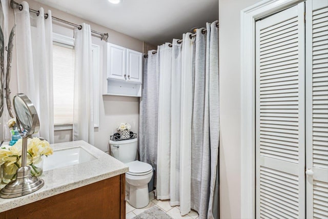 full bath featuring curtained shower, vanity, toilet, and tile patterned floors