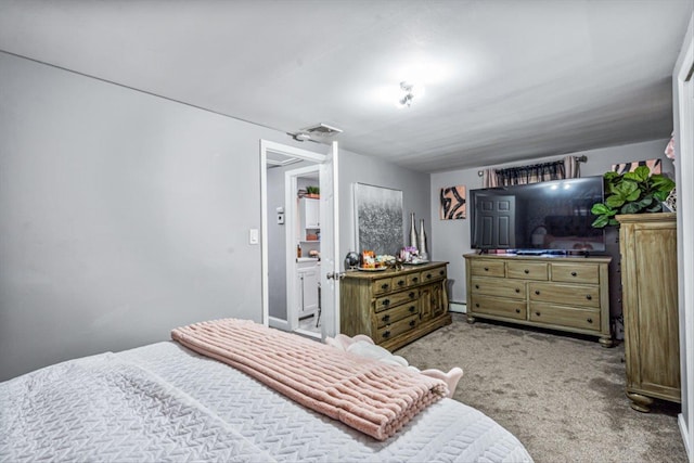 bedroom with visible vents and carpet flooring