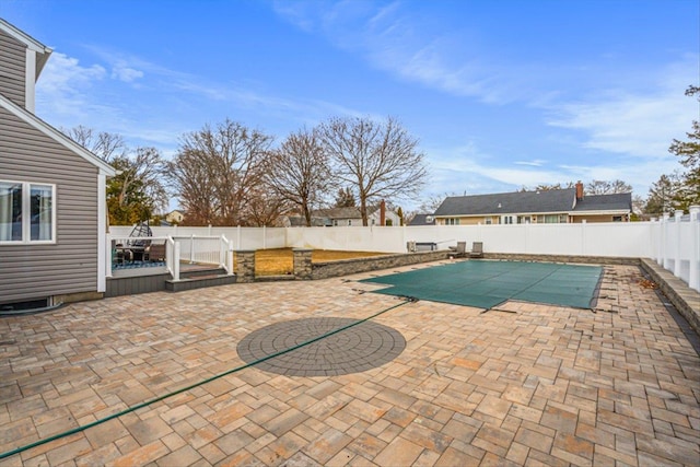 view of swimming pool with a fenced in pool, a patio area, and a fenced backyard