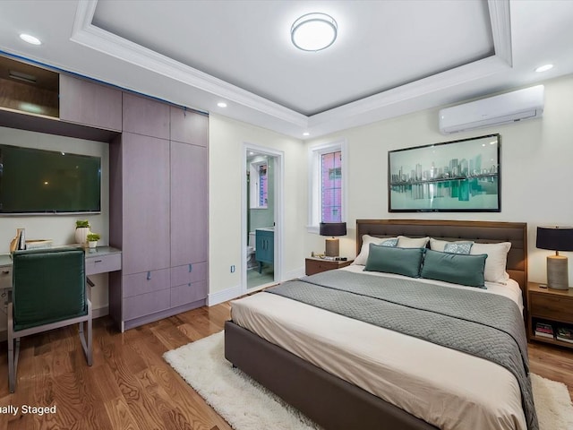 bedroom with baseboards, a raised ceiling, wood finished floors, a wall mounted AC, and recessed lighting