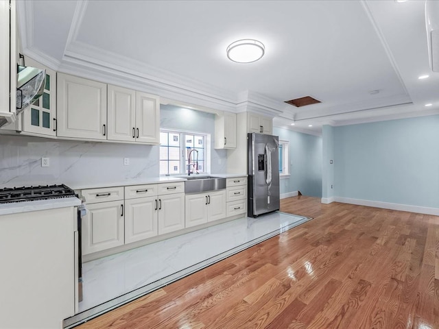 46-38 204th St, Bayside, NY 11361 - kitchen featuring stainless steel appliances, light countertops, white cabinets, ornamental molding, and recessed lighting