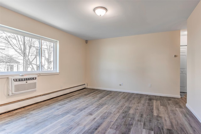 unfurnished room featuring a wall mounted air conditioner, baseboards, baseboard heating, and wood finished floors