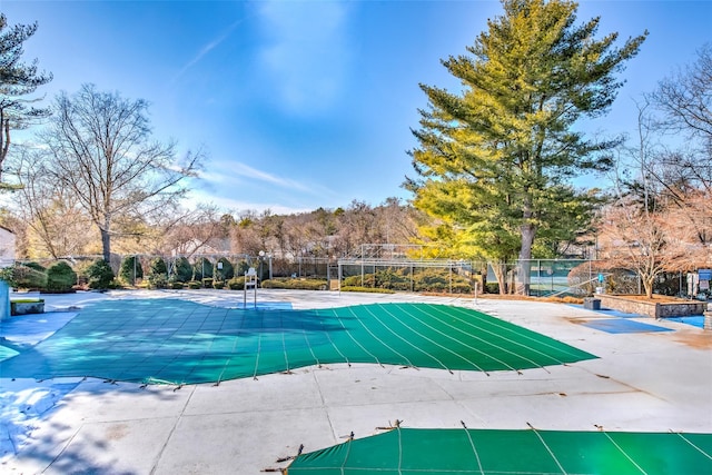 view of pool featuring a pool, a patio area, and fence