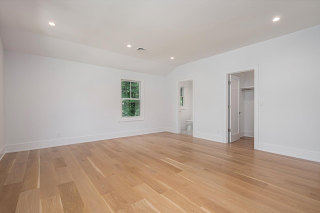 unfurnished room featuring light wood-type flooring, baseboards, visible vents, and recessed lighting