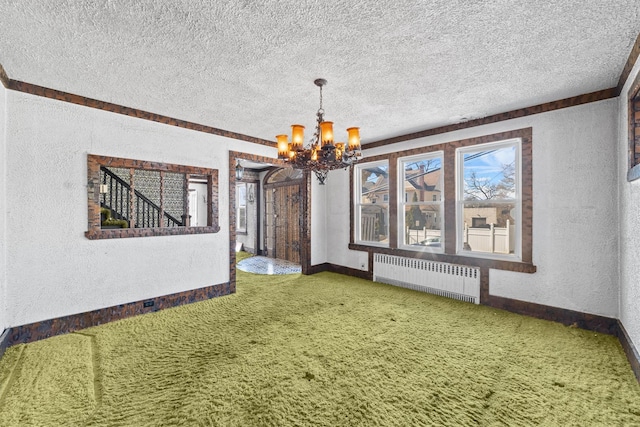 unfurnished dining area with a textured ceiling, a textured wall, and radiator