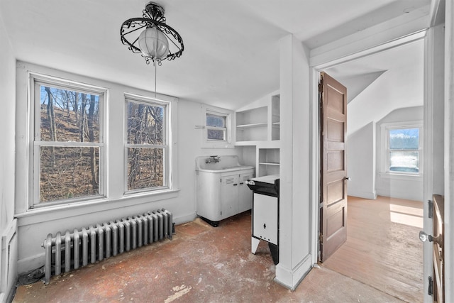 dining room with lofted ceiling and radiator heating unit