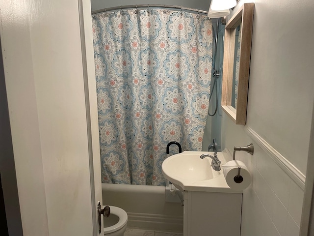 bathroom featuring shower / bath combo and vanity