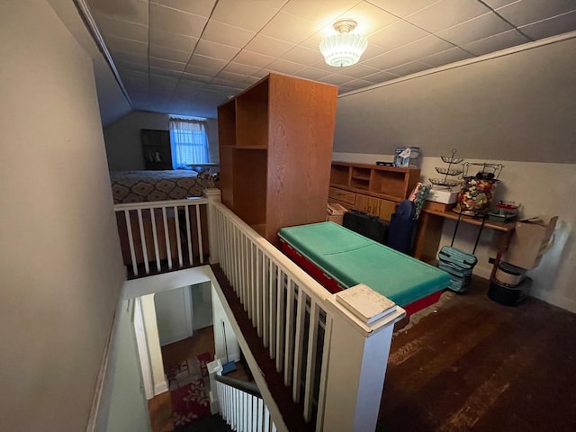 game room with vaulted ceiling and wood finished floors