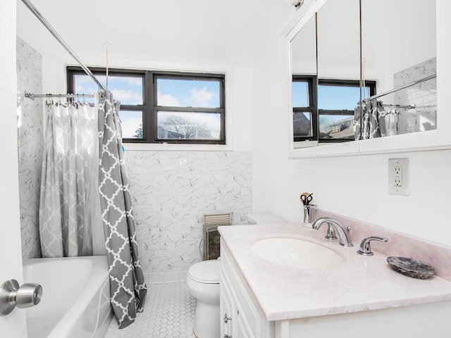 bathroom with toilet, shower / tub combo, a wealth of natural light, and tile patterned floors