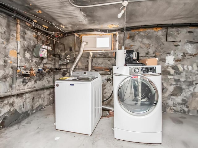 clothes washing area featuring laundry area and washing machine and clothes dryer