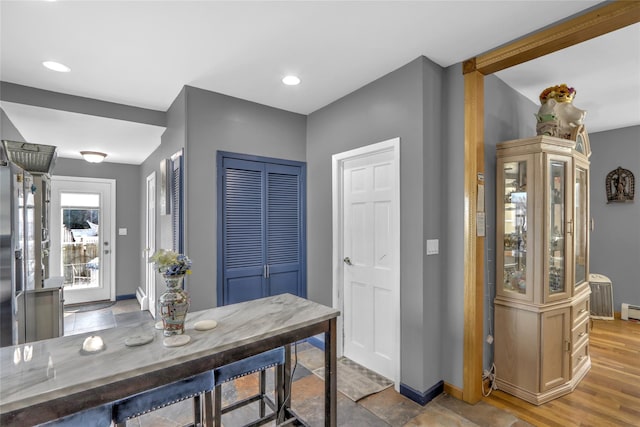 interior space with recessed lighting, light wood-style flooring, and baseboards