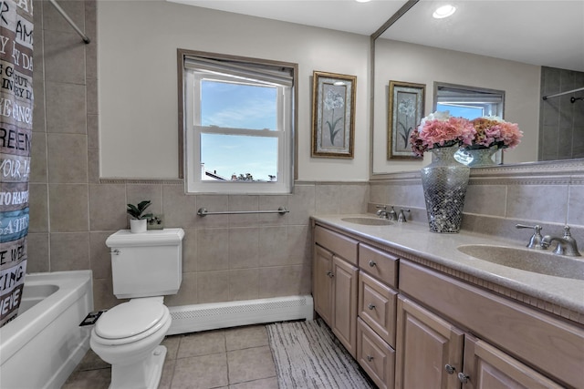 bathroom with toilet, tile patterned flooring, a baseboard radiator, and a sink